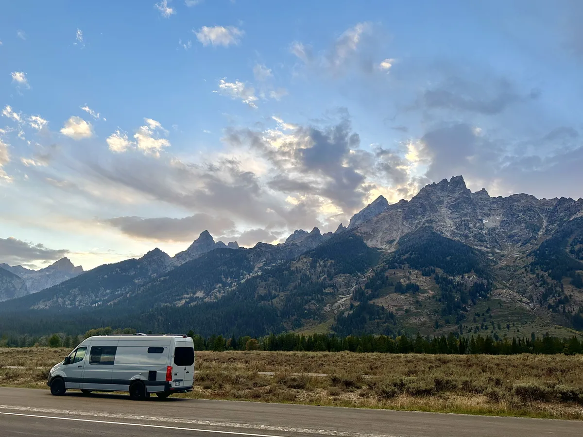 Wide mountain landscape with Pebbles parked below