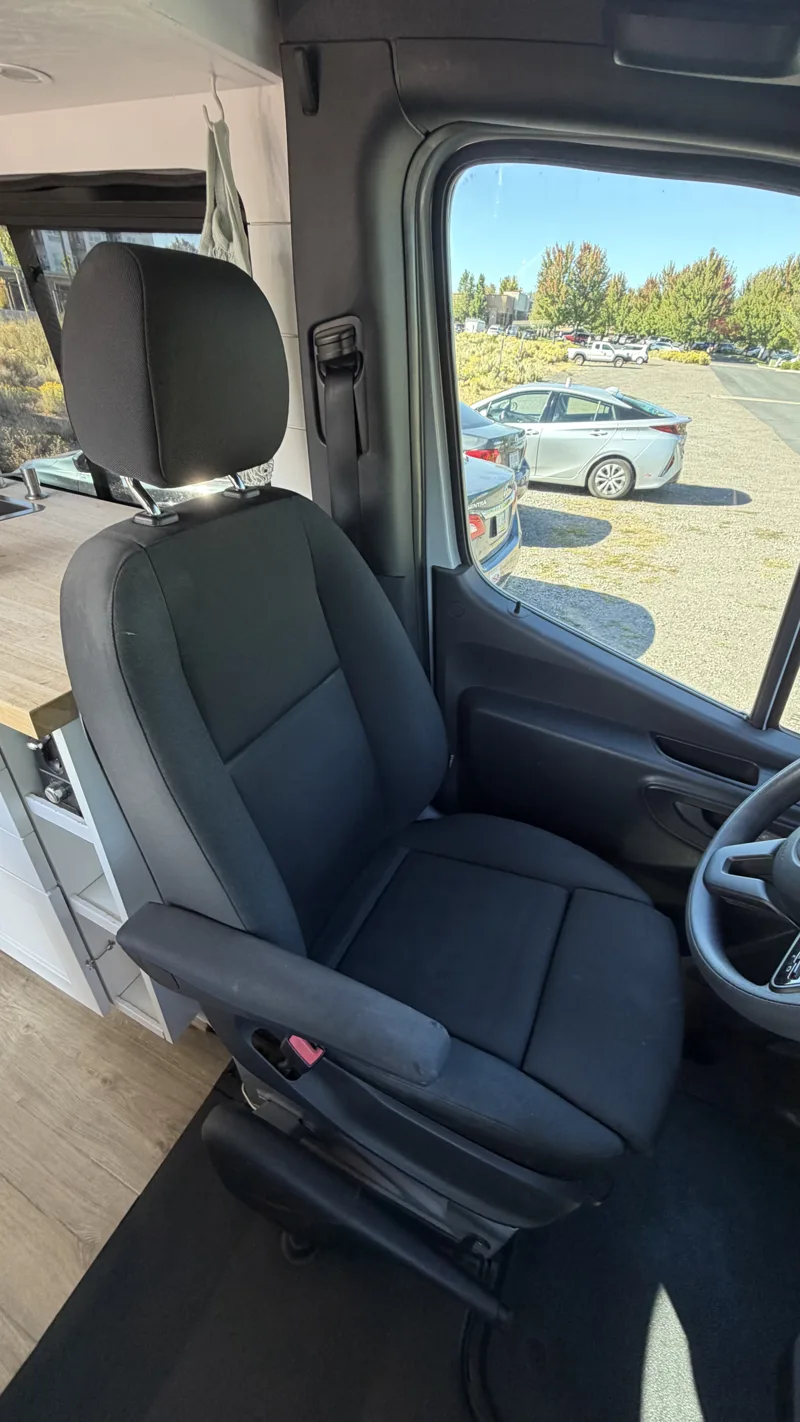 Driver’s seat viewed from inside the van