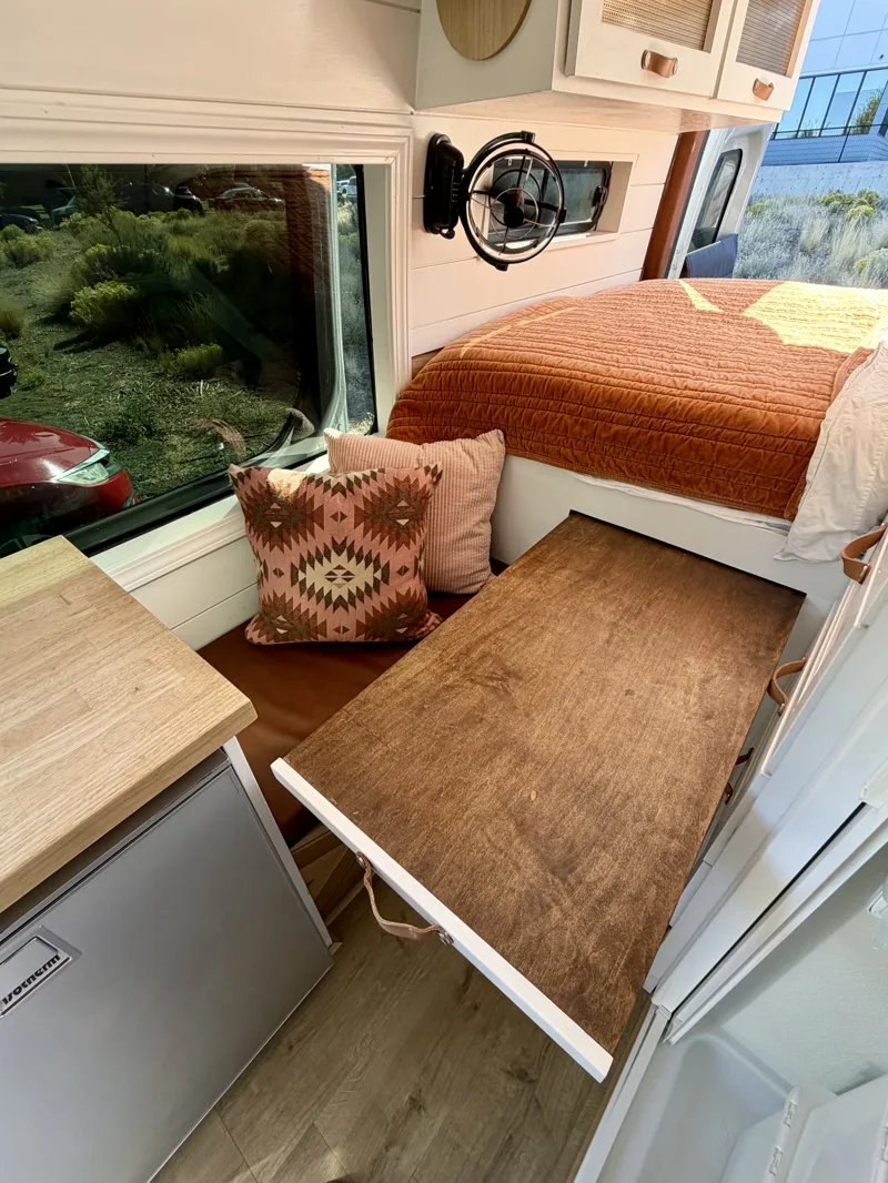 Dining and work table pulled out above the bench seat